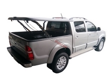 Подъемная крышка TopUp с дугами Toyota Hilux VIII Revo (в грунте) (2015+)